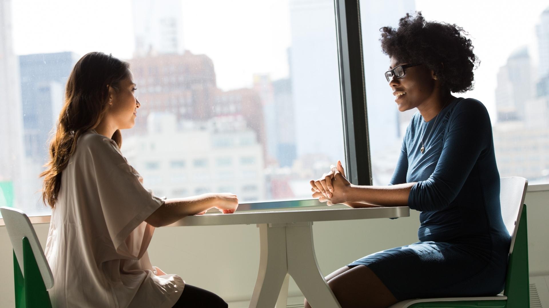 example of interpersonal communication with two women talking